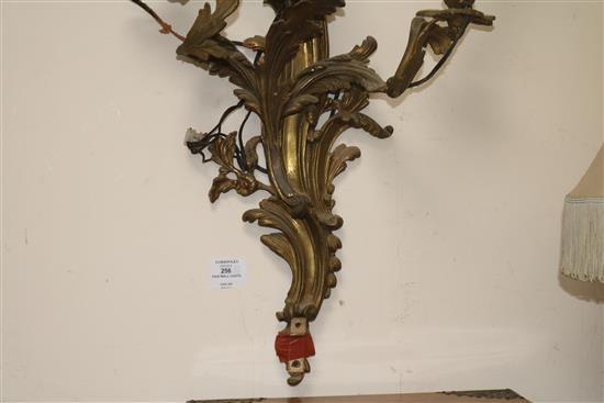 A pair of three branch ormolu wall lights length 55cm